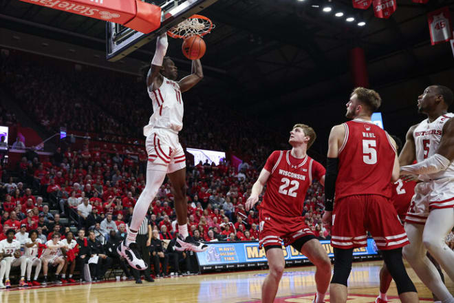 Rutgers Scarlet Knights center Clifford Omoruyi (11) dunks the ball against Wisconsin Badgers forward Steven Crowl (22) and forward Tyler Wahl (5)