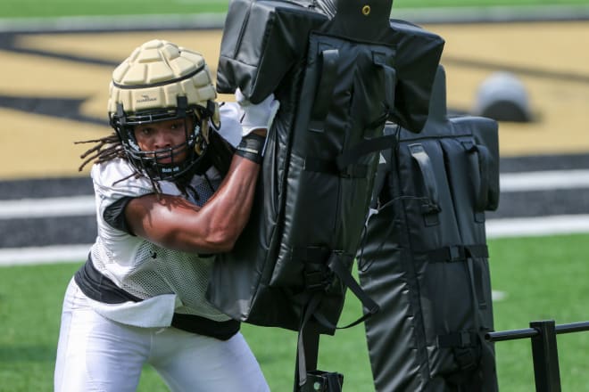 Purdue Boilermaker outside linebacker Kydran Jenkins (4) runs a drill during Purdue football practice, Wednesday, August 2, 2023, at Purdue University in West Lafayette, Ind.