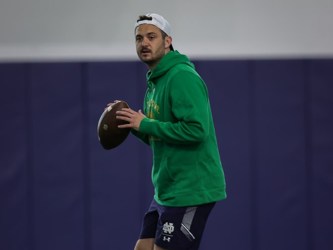 Offensive coordinator Tommy Rees prepares to throw a pass during Notre Dame's first spring football practice on Thursday.