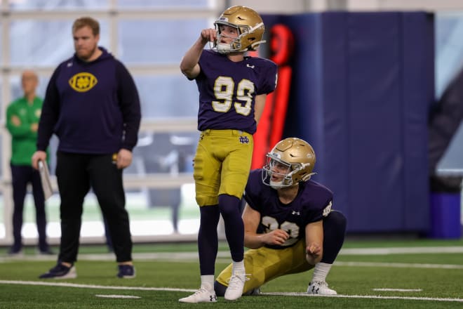 Notre Dame kicker Blake Grupe watches a field goal attempt Saturday in practice sail through the uprights as holder Chris Salerno (32) looks on.