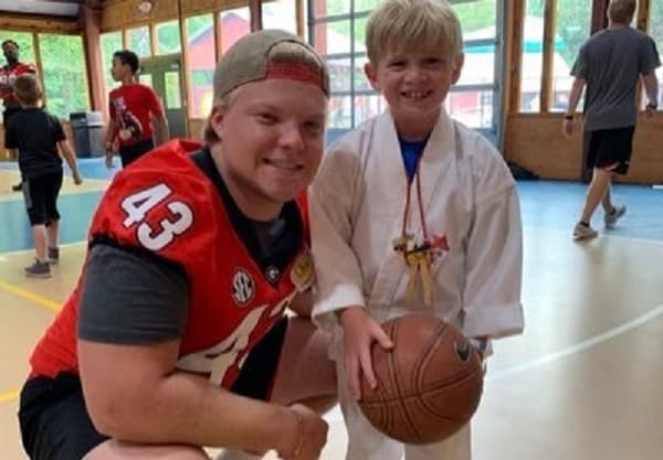 Chase Harof with a young friend at Camp Sunshine.