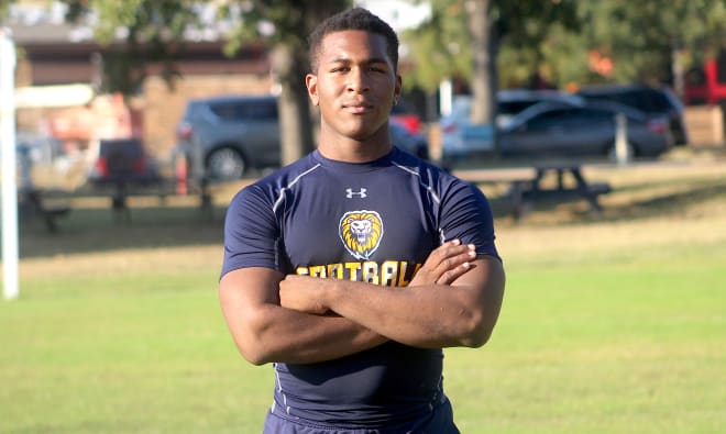 Texas defensive lineman Jadon Scarlett holds a Michigan Wolverines football recruiting offer from Jim Harbaugh.