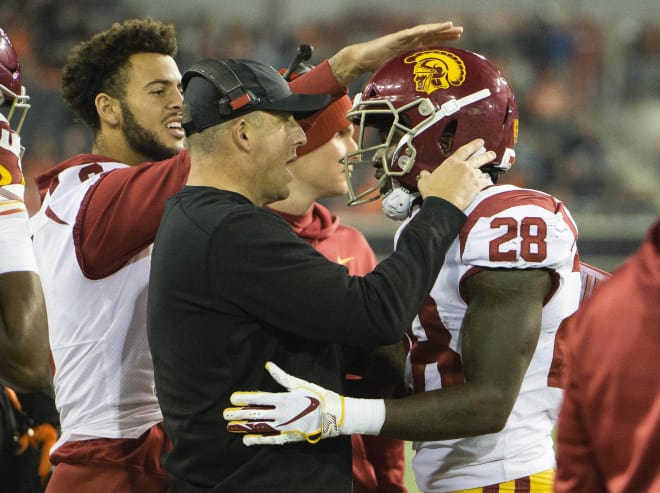 USC head coach Clay Helton congratulates running back Aca'Cedric Ware on Saturday night at Oregon State.