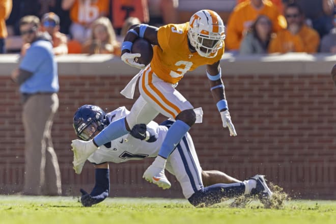 Tennessee defensive back Dee Williams (3) returns a kick as he's upended by UConn defensive back Malik Dixon-Williams (1) during the second half of an NCAA college football game Saturday, Nov. 4, 2023, in Knoxville, Tenn.