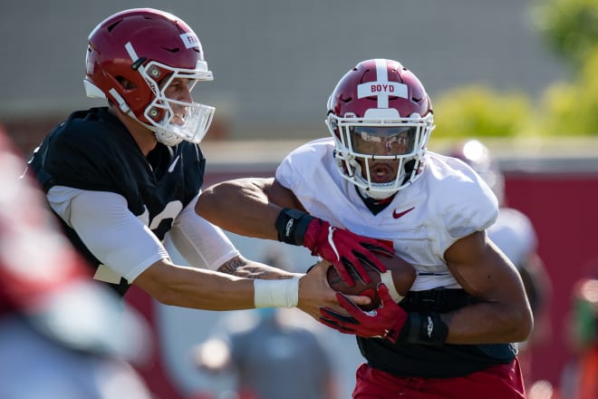 QB Feleipe Franks handing off to Rakeem Boyd in fall camp.