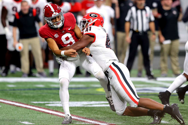 Channing Tindall brings down Dayne Young in the national championship.