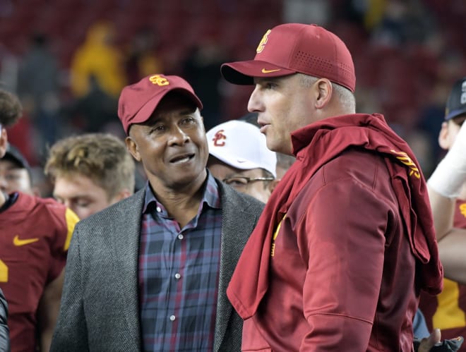 Former USC athletic director Lynn Swann pictured with coach Clay Helton back in 2017.