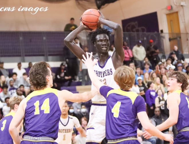 John Bol towers over his opponents 