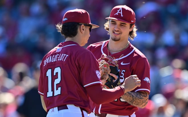 Arkansas RHP Brady Tygart and 3B Jared Sprague-Lott during Saturday's win over Murray State.