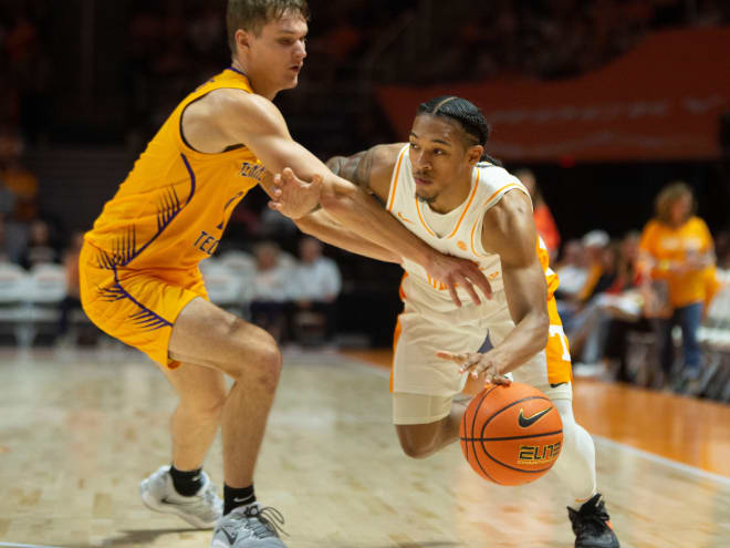 ennessee's Zakai Zeigler (5) tries to get past Tennessee Tech's Grant Strong (11) during an NCAA college basketball game on Monday, November 6, 2023 in Knoxville, Tenn.