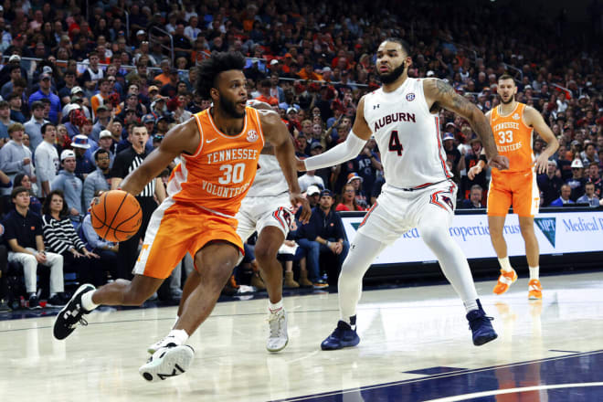 Tennessee guard Josiah-Jordan James (30) drives against Auburn forward Johni Broome (4) in the Vols' 79-70 loss to the Tigers on Saturday.