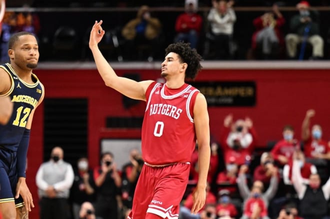 Rutgers G Geo Baker reacts after a making a 3-pointer against Michigan on Tuesday night at Jersey Mike's Arena