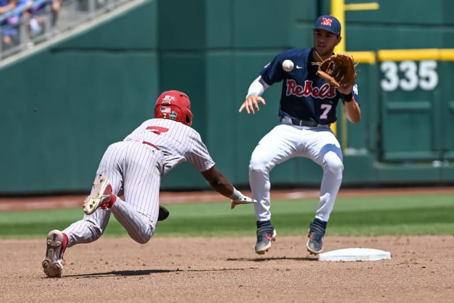 Ole Miss Rebels shortstop Jacob Gonzalez (7) tags out left fielder Kendall Pettis (7) on a steal attempt during the third inning at Charles Schwab Field. Mandatory Credit: Steven Branscombe-USA TODAY Sports