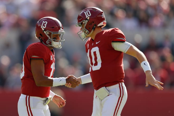 Tua Tagovailoa, left, and Mac Jones shake hands after a play during the 2018 season. Photo | Getty Images 