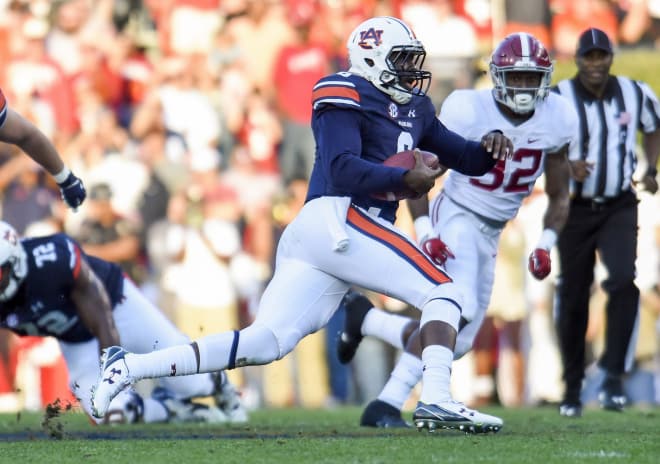 Alabama linebacker Rashaan Evans (32) chases after Auburn quarterback Jeremy Johnson during last season's Iron Bowl. With a win Saturday, Alabama seniors can become the first class since 1981 to beat Auburn four straight years. Photo | USA Today 