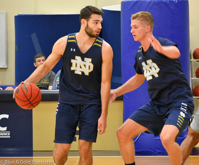 Nikola Djogo (left), guarded by Rex Pflueger in a recent practice, is vying to break into the rotation after redshirting last season.