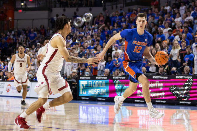 Florida Gators forward Colin Castleton (12) dribbles the ball during the second half against the Alabama Crimson Tide at Billy Donovan Court at Exactech Arena. Photo | Matt Pendleton-USA TODAY Sports