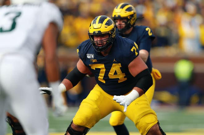 Michigan Wolverines football left guard Ben Bredeson gets ready to block against MSU.
