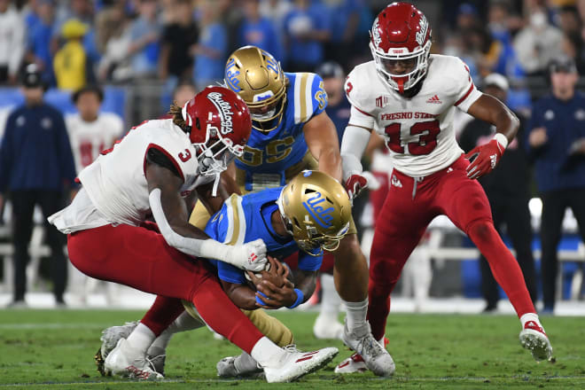 UCLA quarterback Dorian Thompson-Robinson is sacked by Fresno State.