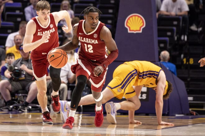 Alabama Crimson Tide guard Latrell Wrightsell Jr. (12) steals the ball from LSU Tigers forward Will Baker (9) during the second half at Pete Maravich Assembly Center. Photo | Stephen Lew-USA TODAY Sports