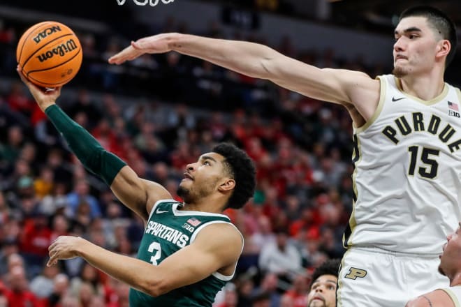 Michigan State guard Jaden Akins (3) makes a layup against Purdue center Zach Edey (15) during the second half of quarterfinal of Big Ten tournament at Target Center in Minneapolis, Minn. on Friday, March 15, 2024.