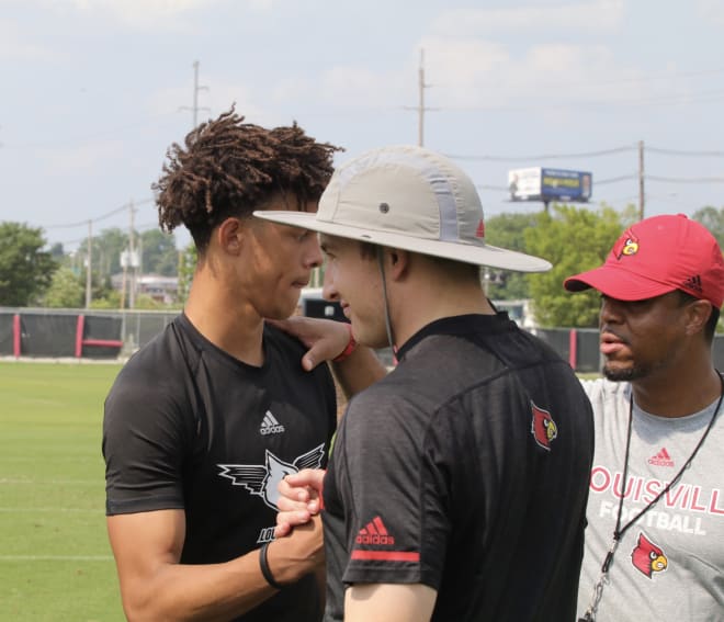 The Louisville staff informs Josh Minkins that he's been awarded a scholarship offer. 