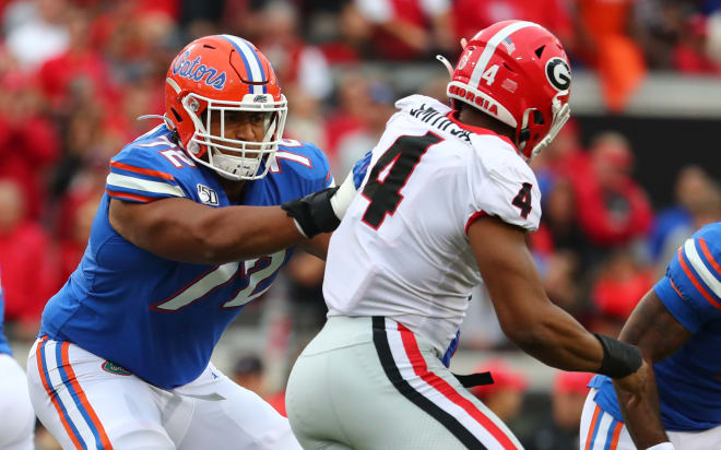 Florida offensive tackle Stone Forsythe blocks Georgia outside linebacker Nolan Smith.