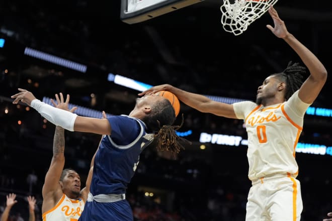 Tennessee forward Jonas Aidoo blocks a shot by Saint Peter's forward Corey Washington during the second half of a first-round college basketball game in the NCAA Tournament, Thursday, March 21, 2024, in Charlotte, N.C. (AP Photo/Chris Carlson)