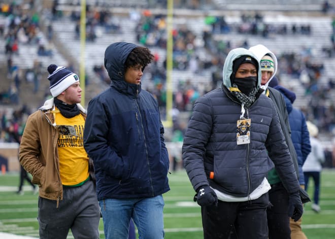 Christian Gray (right) and fellow Notre Dame recruit, QB Kenny Minchey, bundle up for the ND-Boston College game in November.