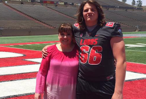 Dylan Weaver with his mother during his official visit to New Mexico