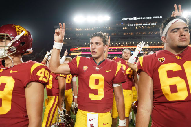 Freshman QB Kedon Slovis walks off the field after making his USC debut Saturday night in the opener against Fresno State.