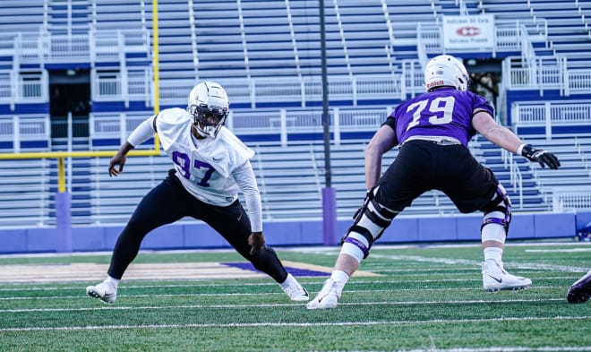 James Madison defensive end Abi N-Okonji (97) rushes up the field as left tackle Ray Gillespie steps right to block during practice this past Friday at Bridgeforth Stadium. 
