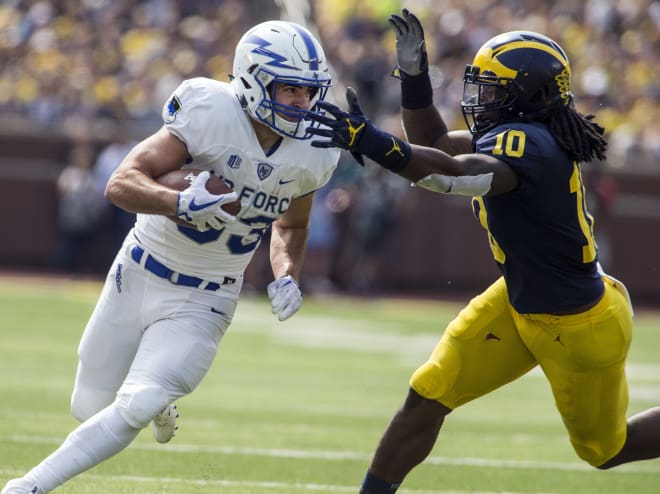 Devin Bush closes in on Air Force running back Tim McVey. 