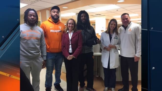 Butch Jones, Jalen Reeves-Maybin, Derek Barnett and Alvin Kamara visit with staff at Erlanger Health System,