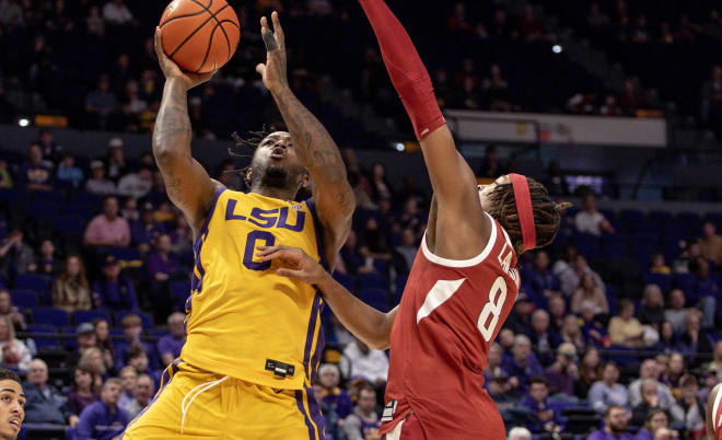 Arkansas forward Chandler Lawson defends a shot attempt by LSU's Trae Hannibal during Saturday's loss to the Tigers in Baton Rouge.
