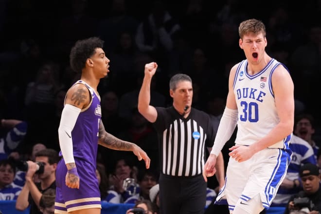 Kyle Filipowski, right, celebrates during Duke's win on Sunday. 