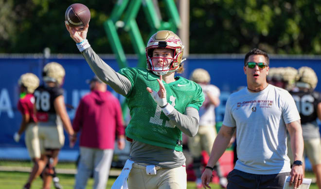 Brock Glenn throwing during Orange Bowl practice Wednesday with QB coach Tony Tokarz.