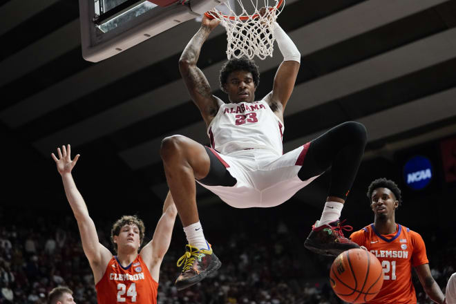  Alabama Crimson Tide forward Nick Pringle (23) dunks past Clemson Tigers center PJ Hall (24) and forward Chauncey Wiggins (21) at Coleman Coliseum. Clemson defeated Alabama 85-77.  Photo | Gary Cosby Jr.-USA TODAY Sports