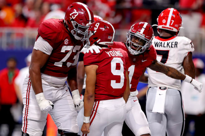Alabama Crimson Tide left tackle Evan Neal (73), quarterback Bryce Young (9) and receiver Jameson Williams (1) celebrate during Saturday's SEC Championship Game vs. Georgia. Photo | Getty Images