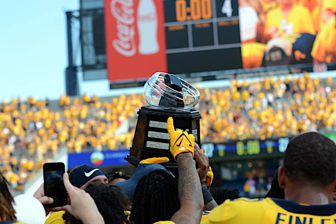The West Virginia Mountaineers football team will travel to Virginia Tech to take on a rival.