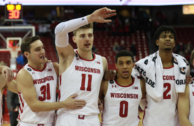 Wisconsin Badgers forward Micah Potter (11) waves his arm at the conclusion of "Varsity" 