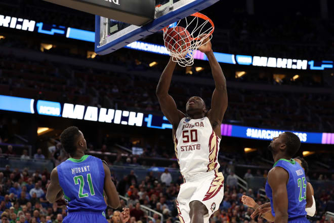 Michael Ojo slams home as dunk during his Florida State career.