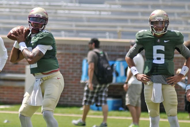 Deondre Francois delivers a pass in warmups Saturday as freshman Malik Henry looks on.