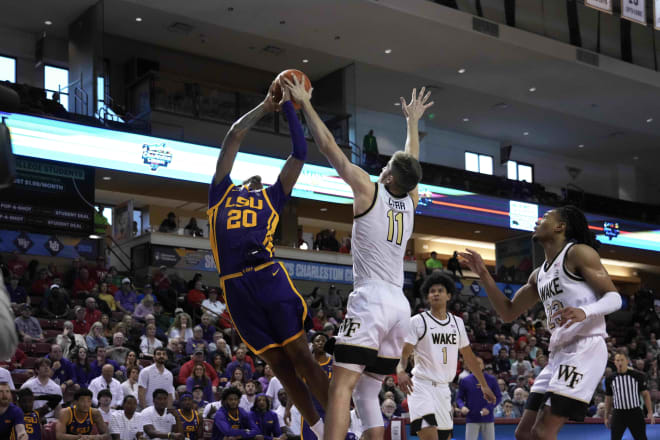 Wake Forest's Andrew Carr, middle, blocks a shot against LSU's Derek Fountain the last time the Deacons played a game that wasn't at Joel Coliseum. 