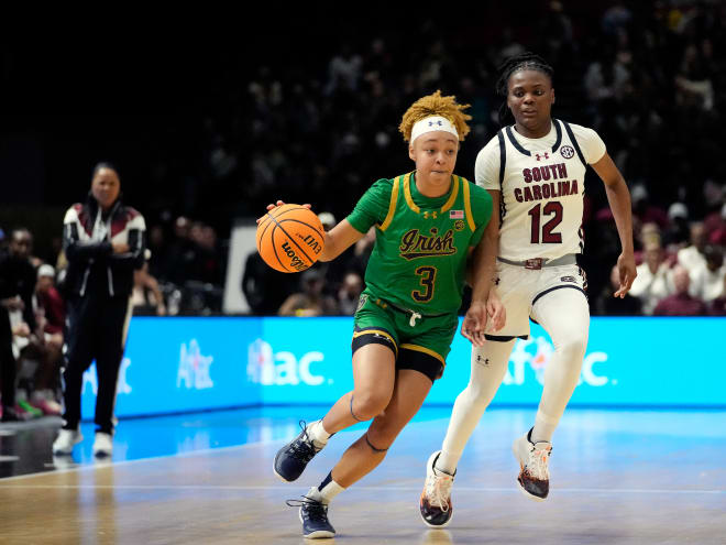 Notre Dame freshman guard Hannah Hidalgo, left, scored 31 points in her first career game against head coach Dawn Staley's South Carolina team. Pictured: MiLaysia Fulwiley guards Hidalgo in a 100-71 South Carolina win.
