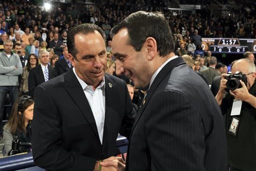 Notre Dame men’s basketball coach Mike Brey (left) talking to Duke head coach Mike Krzyzewski, who was his mentor in the late 80s and early 90s.