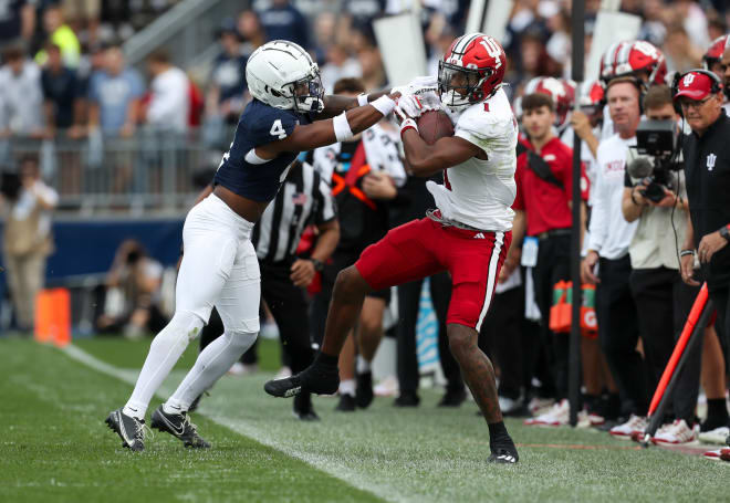 Indiana Hoosiers wide receiver Donaven McCulley (1) is pushed out of bounds by Penn State Nittany Lions cornerback Kalen King (4) during the third quarter at Beaver Stadium. Penn State defeated Indiana 33-24. Mandatory Credit: Matthew O'Haren-USA TODAY Sports