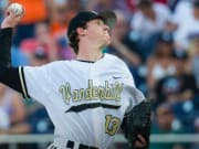 Vanderbilt Commodores starting pitcher Walker Buehler (13) delivers a pitch  to the plate against the TCU Horned Frogs in Game 12 of the NCAA College  World Series on June 19, 2015 at