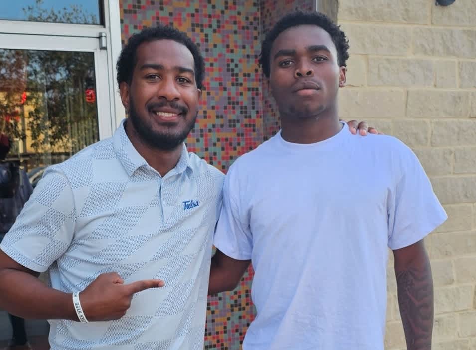 Keilan Chavies with Tulsa Assoc. HC/RB Coach Kam Martin.