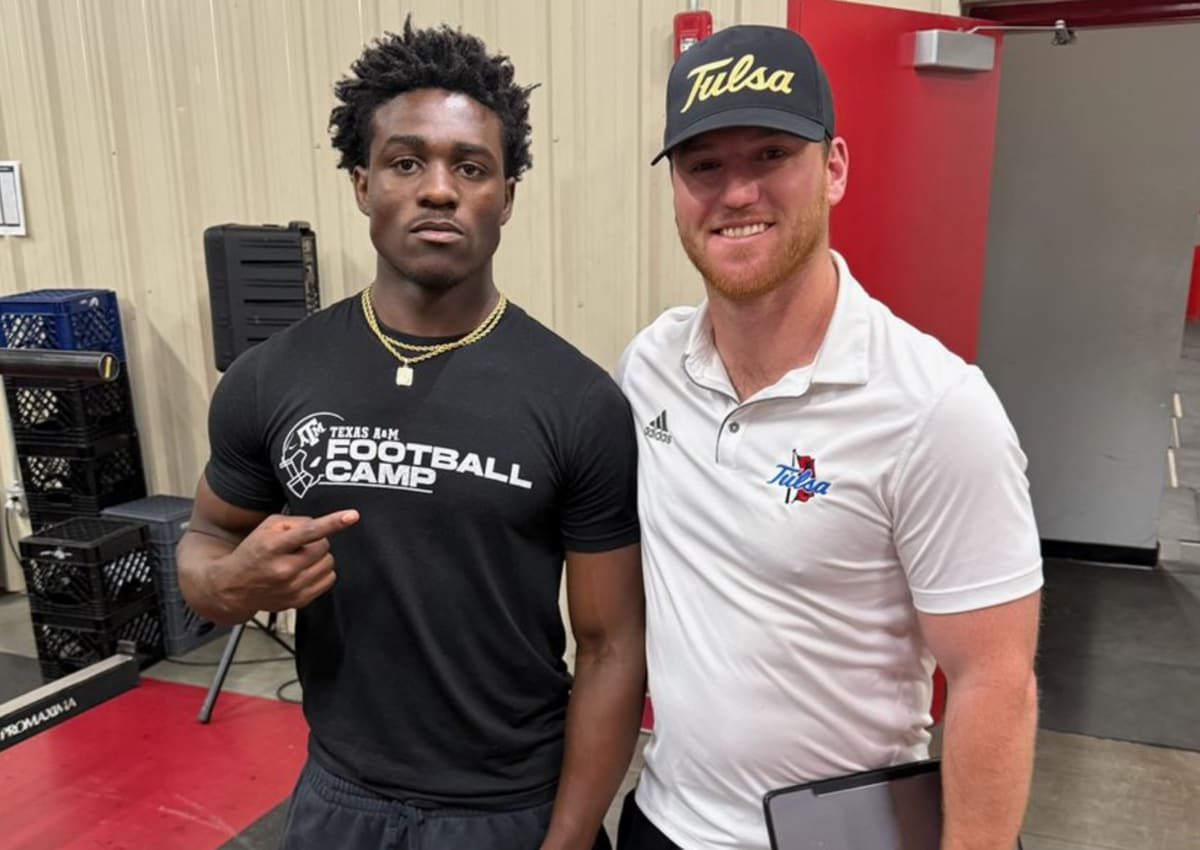 Ricklan Holmes with Tulsa assistant coach Mike Gray